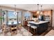 Modern kitchen with island, stainless steel appliances, and breakfast nook at 27319 E Nova Cir, Aurora, CO 80016