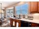 Bright kitchen featuring updated appliances, countertop space, and an adjacent dining area at 27319 E Nova Cir, Aurora, CO 80016
