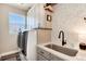Well-equipped laundry room with modern machines, ample counter space, and sleek white cabinetry at 27319 E Nova Cir, Aurora, CO 80016