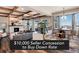 Bright living room boasts a coffered ceiling, fireplace, and an open floor plan that flows into the dining area at 27319 E Nova Cir, Aurora, CO 80016