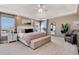 Bright main bedroom with a king-size bed and large windows at 27319 E Nova Cir, Aurora, CO 80016