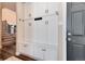 Functional mudroom features built-in storage cabinets and seating; seamlessly blends style with practicality at 27319 E Nova Cir, Aurora, CO 80016