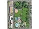 Aerial view shows neighborhood park with fitness equipment, pool, and recreation center at 1111 Osage St # 7, Denver, CO 80204