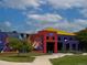 Exterior of the neighborhood's colorful community center with a mural, set against a bright, partly cloudy sky at 1111 Osage St # 7, Denver, CO 80204