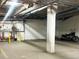 Interior parking with painted space numbers, sprinkler system and motorcycle at 1111 Osage St # 7, Denver, CO 80204