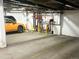 Interior parking garage view with designated spaces and an orange Subaru at 1111 Osage St # 7, Denver, CO 80204