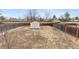Spacious backyard with a storage shed, surrounded by a wooden fence at 3977 S Pitkin Way, Aurora, CO 80013