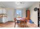 Cozy dining area features hardwood floors, ample natural light, and a charming view of the outdoors at 3977 S Pitkin Way, Aurora, CO 80013