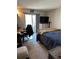 Cozy bedroom featuring a walk-out patio, and a comfortable bed setup perfect for relaxation at 5735 W Atlantic Pl # 101, Lakewood, CO 80227