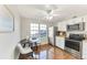 Bright dining area with a round table, modern chairs, and natural light at 5735 W Atlantic Pl # 101, Lakewood, CO 80227
