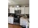 Bright kitchen featuring stainless steel appliances, white cabinetry, and ample counter space for cooking at 5735 W Atlantic Pl # 101, Lakewood, CO 80227