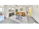 Stylish living room with modern furnishings and an open layout connecting to the kitchen at 5735 W Atlantic Pl # 101, Lakewood, CO 80227