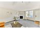 Cozy living room featuring a fireplace, large windows and neutral decor at 5735 W Atlantic Pl # 101, Lakewood, CO 80227