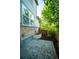 Charming backyard patio area features a stone surface, brick accents, and green garden space at 359 Courtfield Way, Castle Pines, CO 80108