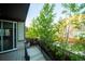 Balcony with black railings and lush green landscaping at 359 Courtfield Way, Castle Pines, CO 80108