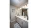 Bright bathroom featuring a double vanity with white countertop and modern fixtures at 359 Courtfield Way, Castle Pines, CO 80108