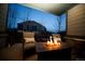 Inviting covered porch featuring a warm fire pit and comfortable seating at 359 Courtfield Way, Castle Pines, CO 80108