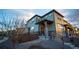 Inviting two-story home featuring professional rock landscaping, a cozy front porch, and neutral siding at 359 Courtfield Way, Castle Pines, CO 80108