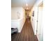 Long hallway featuring wood floors, natural light, and decorative accents at 359 Courtfield Way, Castle Pines, CO 80108