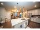 Spacious kitchen featuring a large island with seating and stainless steel appliances at 359 Courtfield Way, Castle Pines, CO 80108