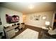 Comfortable living room with large TV, workspace, and decorative wall art at 359 Courtfield Way, Castle Pines, CO 80108