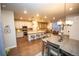 Open-concept kitchen, dining, and living areas, great for entertaining and Gathering gatherings at 359 Courtfield Way, Castle Pines, CO 80108