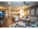 Open-concept living space seamlessly connects the kitchen, living room, and dining area at 359 Courtfield Way, Castle Pines, CO 80108