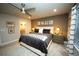 Large main bedroom suite with decorative mirrors and a window at 359 Courtfield Way, Castle Pines, CO 80108