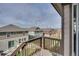 A pleasant view from the balcony of the surrounding neighborhood and the fenced yards of neighboring homes at 21436 E Stanford Ave, Aurora, CO 80015