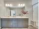 Bathroom featuring a double sink vanity, sleek lighting, and decor at 21436 E Stanford Ave, Aurora, CO 80015