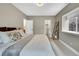 Calm bedroom featuring neutral tones, large window and comfortable king size bed at 21436 E Stanford Ave, Aurora, CO 80015