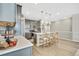 Expansive kitchen featuring island seating, stainless steel appliances, and ample counter space for meal preparation at 21436 E Stanford Ave, Aurora, CO 80015