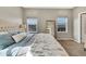 Serene main bedroom featuring windows with neighborhood views and a full length mirror at 21436 E Stanford Ave, Aurora, CO 80015