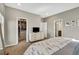 Main bedroom with walk-in closet, dresser, and access to the ensuite bath at 21436 E Stanford Ave, Aurora, CO 80015