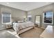 Relaxing main bedroom with plush bedding, neutral tones and abundant natural light at 21436 E Stanford Ave, Aurora, CO 80015