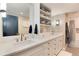 Modern bathroom featuring double sinks, white quartz countertops, and stylish storage at 8004 S Oneida Ct, Centennial, CO 80112