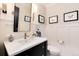 Charming powder room with modern fixtures, a stylish mirror, and decorative accents at 8004 S Oneida Ct, Centennial, CO 80112