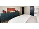 Bright bedroom features a large dresser, art and decor, and an open doorway to another room at 8004 S Oneida Ct, Centennial, CO 80112