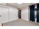 This bedroom features a closet with sliding doors, and a window with curtains at 8004 S Oneida Ct, Centennial, CO 80112
