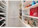 Organized walk-in closet featuring shelving, drawers, and a cabinet for plenty of storage options at 8004 S Oneida Ct, Centennial, CO 80112