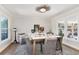 Dining room featuring a modern light fixture and furniture, as well as decor at 8004 S Oneida Ct, Centennial, CO 80112