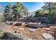 Rustic vegetable garden featuring raised beds, mulch and decorative stone accents at 8004 S Oneida Ct, Centennial, CO 80112