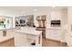 Spacious kitchen with stainless steel appliances, white cabinets, and central island at 8004 S Oneida Ct, Centennial, CO 80112