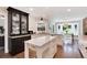 Charming kitchen with white cabinets, black accents, and a large island perfect for entertaining at 8004 S Oneida Ct, Centennial, CO 80112