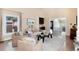 Comfortable living room with vaulted ceilings, large windows, and a neutral color palette at 8004 S Oneida Ct, Centennial, CO 80112