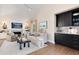 Spacious living room featuring a fireplace, built-in cabinets, and a bar area at 8004 S Oneida Ct, Centennial, CO 80112