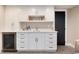 Basement wet bar with white cabinets, a sink, countertops, and a wine fridge at 8004 S Oneida Ct, Centennial, CO 80112