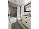 Cozy bathroom with tub, shower, vanity and neutral color palette at 13781 E Lehigh Ave # E, Aurora, CO 80014