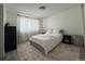 Serene bedroom featuring a comfortable bed, soft lighting, and neutral decor at 13781 E Lehigh Ave # E, Aurora, CO 80014