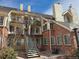 Multi-story apartment building with brick and siding at 13781 E Lehigh Ave # E, Aurora, CO 80014